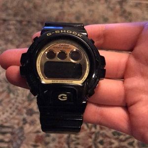 Gold and Black G-shock watch